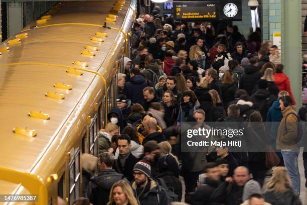 People commute via the unaffected underground U-Bahn service at Alexanderplatz station during a nationwide strike on March 27, 2023 in Berlin,...