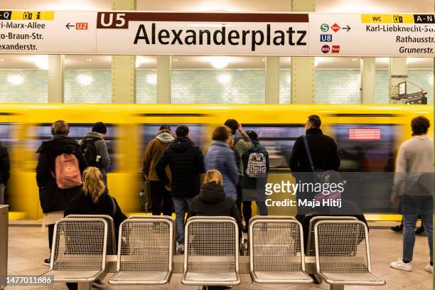 People commute via the unaffected underground U-Bahn service at Alexanderplatz station during a nationwide strike on March 27, 2023 in Berlin,...