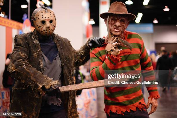 Cosplayers dressed as Jason Voorhees and Freddy Krueger pose at WonderCon 2023 at Anaheim Convention Center on March 26, 2023 in Anaheim, California.