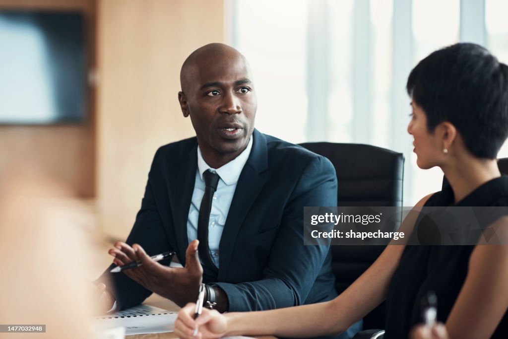 Black man, leadership and corporate meeting in office with executive management, investor feedback and strategy. Professional business manager, team discussion and CEO in financial investment seminar