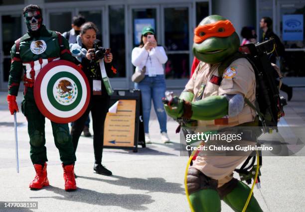 Cosplayer dressed as a Teenage Mutant Ninja Turtle in a Ghostbusters outfit at WonderCon 2023 at Anaheim Convention Center on March 26, 2023 in...