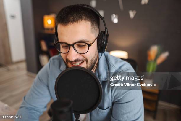 young men recording a podcast - apresentador de programa televisivo imagens e fotografias de stock