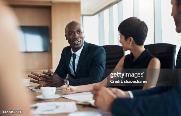business meeting, speaking and black man with discussion, planning and corporate proposal, staff update and leadership. professional people in conference room talking, listening and career strategy - lawyers stock pictures, royalty-free photos & images