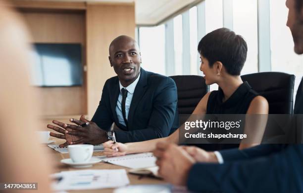 business meeting, speaking and black man with discussion, planning and corporate proposal, staff update and leadership. professional people in conference room talking, listening and career strategy - chief executive officer 個照片及圖片檔