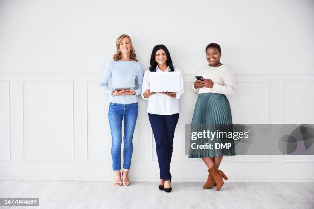 business people in portrait with technology, communication and smile with diversity, team working together. happiness, corporate women group and laptop with smartphone and tablet for networking - colleague engagement stock pictures, royalty-free photos & images