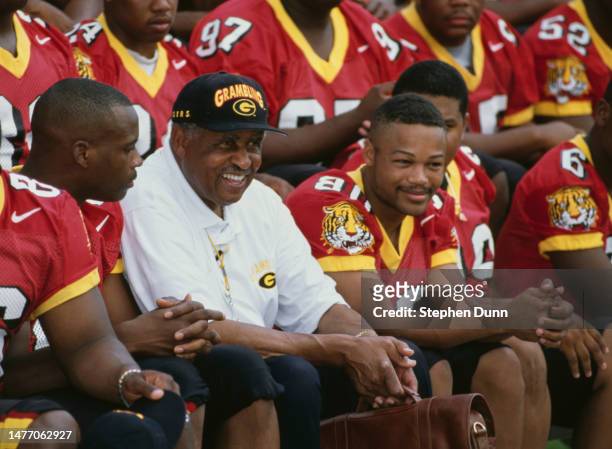 Eddie Robinson , Head Coach of the Grambling State University Tigers football team talks with his players during Media Day on 13th August 1997 at the...