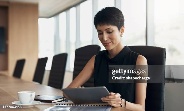 business, woman and working on tablet in office, planning online strategy and innovation for data management. female executive manager, digital technology and review financial research in boardroom - law office 個照片及圖片檔