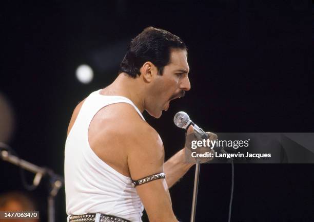 Singer Freddie Mercury of British rock group Queen performs at the Live Aid concert at Wembley Stadium in London, 13th July 1985. The concert raised...