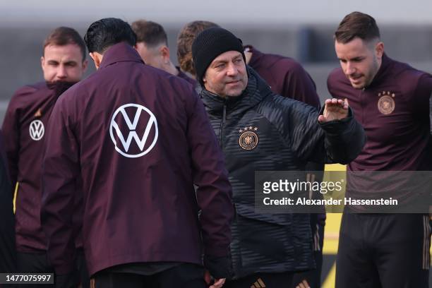 Hans-Dieter Flick, head coach talks to his players of Germany during training session of the German national team at DFB-Campus on March 27, 2023 in...