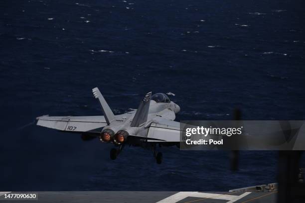 Navy F-18 Super Hornet take off on the flight deck of the USS Aircraft Carrier Nimitz during an South Korea and US combined maritime exercise as a...