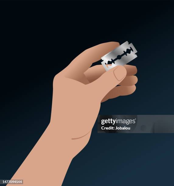 hand holding razor blade alertness mood and feeling concept - blade stock illustrations
