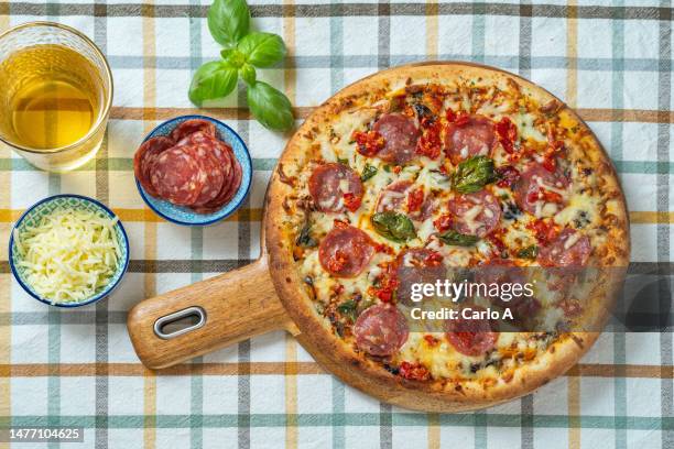 pizza pepperoni - pepperoni pizza overhead stock pictures, royalty-free photos & images