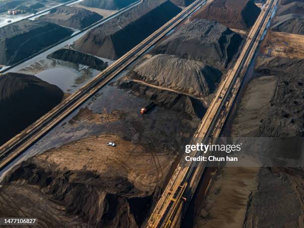 aerial view of black coal stacked in coal port - ship fumes stock pictures, royalty-free photos & images