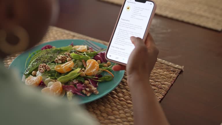 https://media.gettyimages.com/id/1477143541/video/woman-checking-nutrition-information-and-calories-on-her-phone-when-eating.jpg?b=1&s=640x640&k=20&c=1xCwOpmObb5bGoSuVQcFLgwVy6idEw3JAn23GwRDFDs=