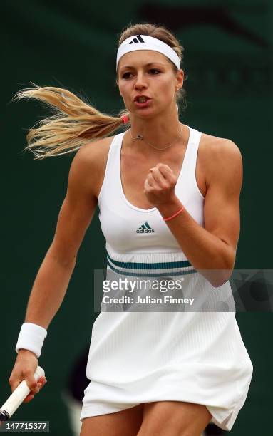 Maria Kirilenko of Russia celebrates match point during her Ladies' singles fourth round match against Shuai Peng of China on day seven of the...