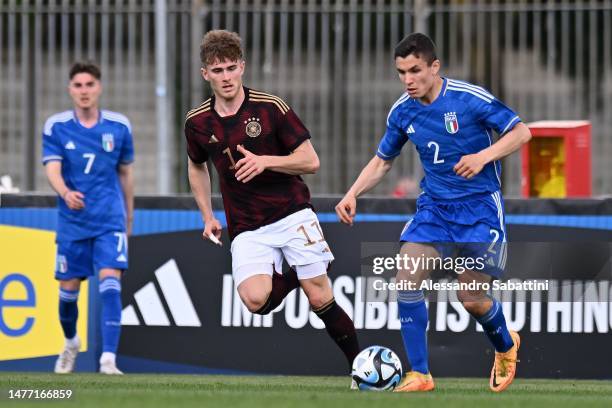 Tim Rossmann of Germany U20 competes for the ball with Mattia Zanotti of Italy U20 during the U20 international friendly match between Italy and...