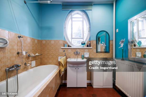 red blue and beige outdated bathroom. - sink stock pictures, royalty-free photos & images