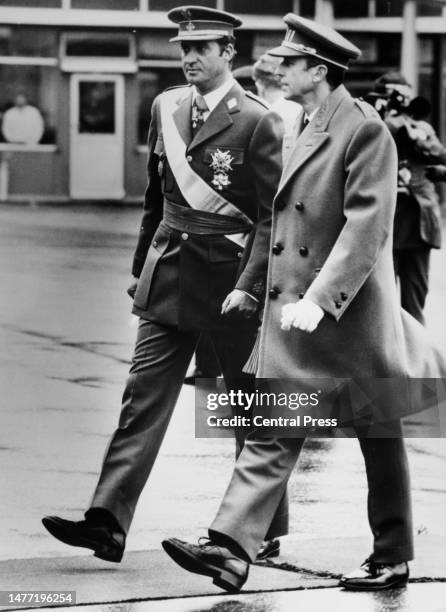 Spanish Royal Juan Carlos I, King of Spain, in conversation with Belgian Royal Baudouin of Belgium, after the Spanish Royal had arrived at Brussels...