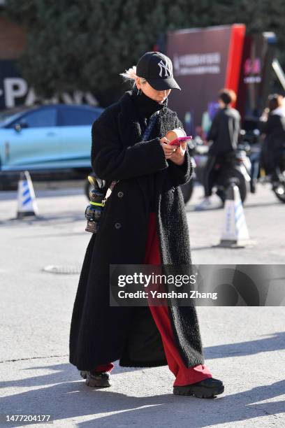 Guest is seen attending the Dingfei show in China Fashion Week 2023 A/W on March 27, 2023 in Beijing, China.