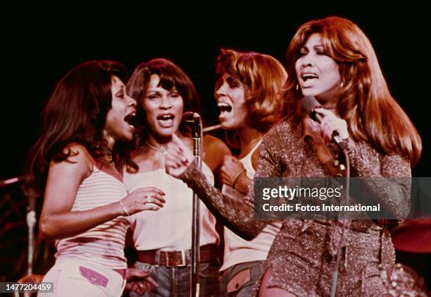 Tina Turner performs with backing vocalists 'The Ikettes' on the American television music variety show 'Don Krishner's Rock Concert', 1976.