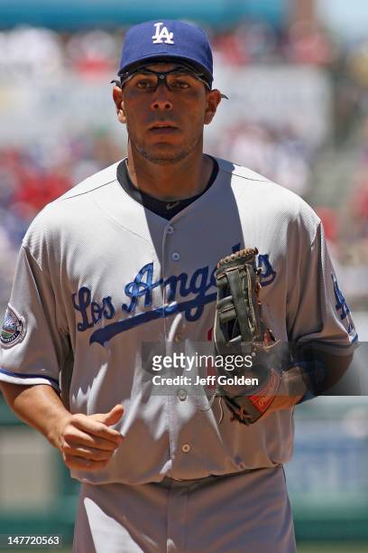 Juan Rivera of the Los Angeles Dodgers jogs to the dugout against the Los Angeles Angels of Anaheim at the end of the second inning of the...
