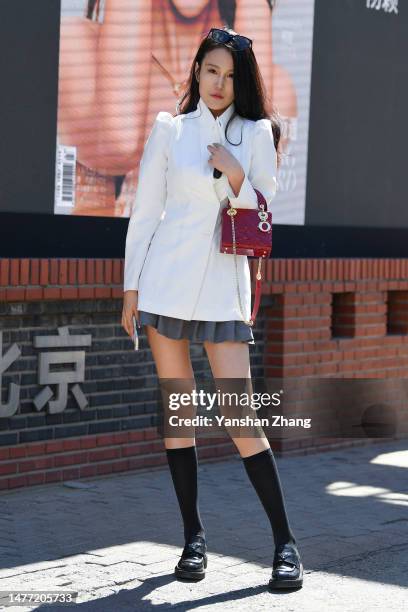 Guest is seen attending the LIQINGWEI show in China Fashion Week 2023 A/W on March 27, 2023 in Beijing, China.