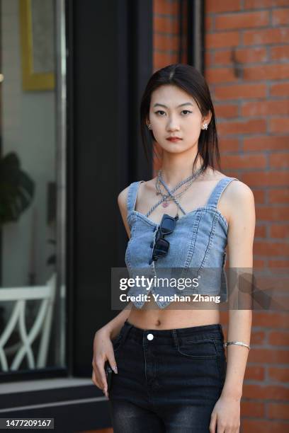 Guest is seen attending the LIQINGWEI show in China Fashion Week 2023 A/W on March 27, 2023 in Beijing, China.