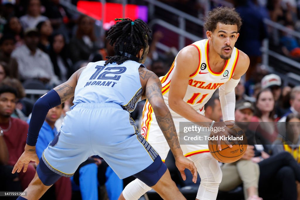 Memphis Rau Trae Young of the Atlanta Hawks is defended by Ja Morant of the... News ...
