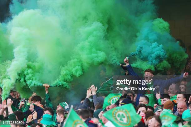 Republic of Ireland fans show their support with flares prior to the UEFA EURO 2024 qualifying round group B match between Republic of Ireland and...