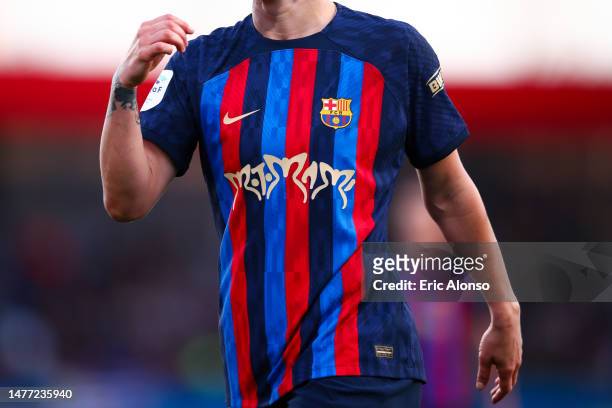 Detailed picture of the logo of Spanish Singer-Songwriter, Rosalia on the match t-shirt during the Finetwork Liga F match between FC Barcelona and...