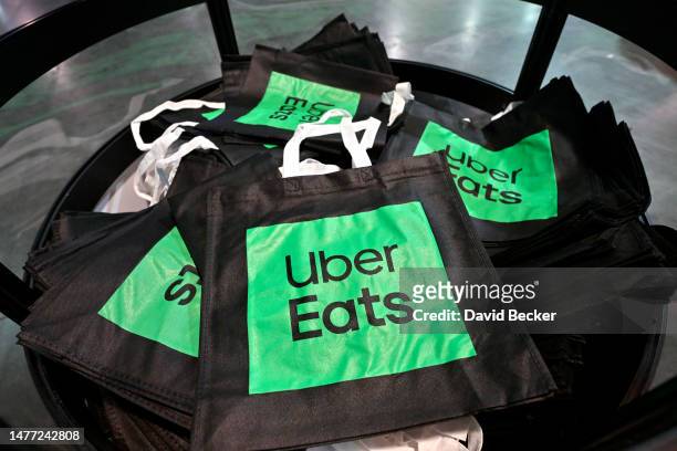 Custom Uber Eats bags are on display at the 2023 Bar & Restaurant Expo and World Tea Expo on March 27, 2023 at the Las Vegas Convention Center in Las...