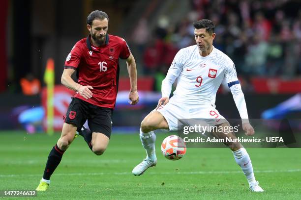 Robert Lewandowski C of Poland is challenged by Sokol Cikalleshi of Albania during the UEFA EURO 2024 qualifying round group B match between Poland...