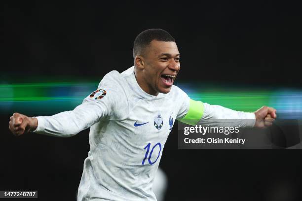 Kylian Mbappe of France celebrates after teammate Benjamin Pavard scores the team's first goal scoring the team's first goal during the UEFA EURO...