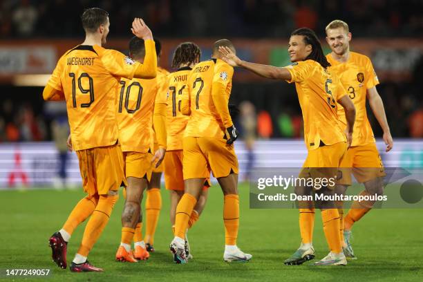 Nathan Ake of Netherlands celebrates with teammates after scoring the team's second goal during the UEFA EURO 2024 qualifying round group B match...