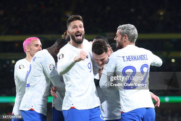 Olivier Giroud of France celebrates with teammates after Benjamin Pavard scores the team's first goal during the UEFA EURO 2024 qualifying round...