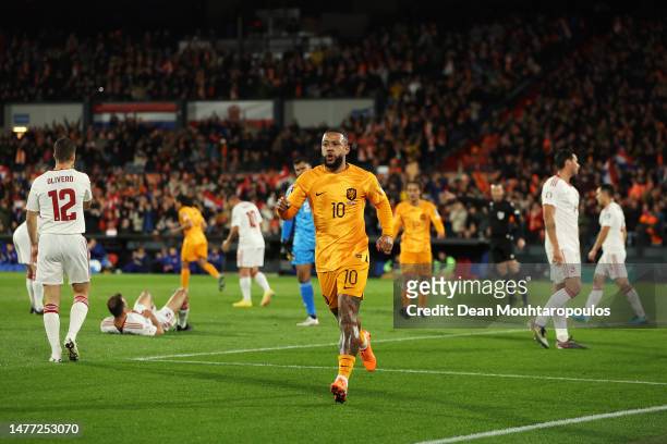 Memphis Depay of Netherlands celebrates after scoring the team's first goal during the UEFA EURO 2024 qualifying round group B match between...