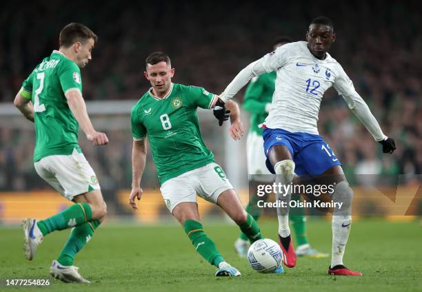 Alan Browne of Republic of Ireland battles for possession with Randal Kolo Muani of France during the UEFA EURO 2024 qualifying round group B match...