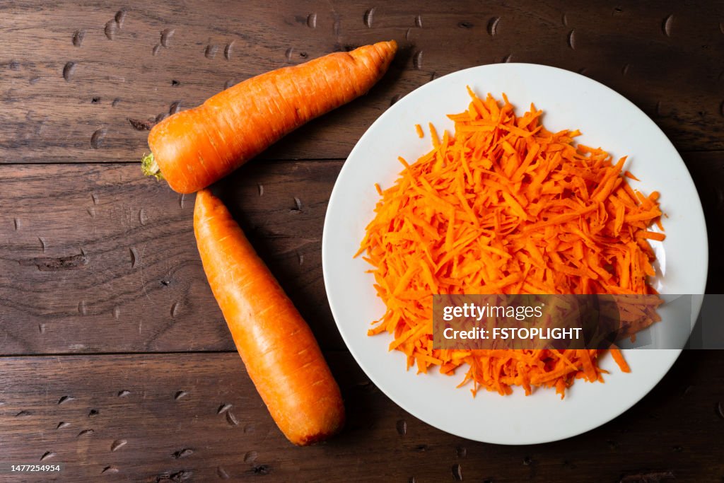 Grated carrot in white plate