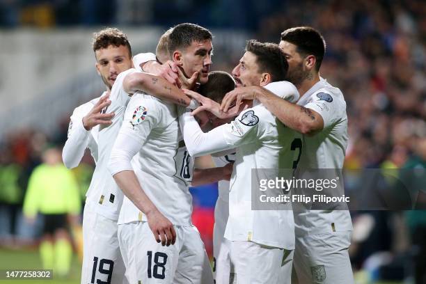 Dusan Vlahovic of Serbia celebrates after scoring the team's second goal with teammates during the UEFA EURO 2024 qualifying round group B match...