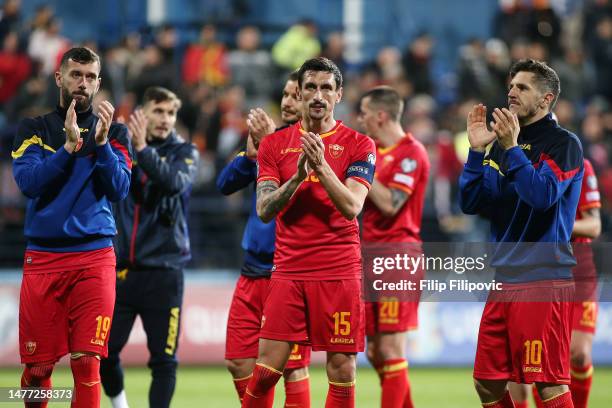 Aleksandar Scekic, Stefan Savic and Stevan Jovetic of Montenegro applaud their fans after the UEFA EURO 2024 qualifying round group B match between...