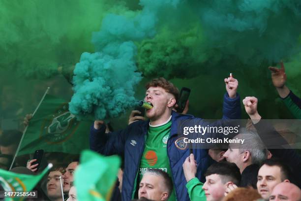 Fans show their support with flares in the stands prior to the UEFA EURO 2024 qualifying round group B match between Republic of Ireland and France...