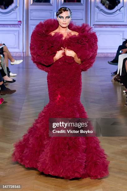 Model walks the runway at the Jantaminiau Haute-Couture Show as part of Paris Fashion Week Fall / Winter 2013 at Salle Erard on July 2, 2012 in...