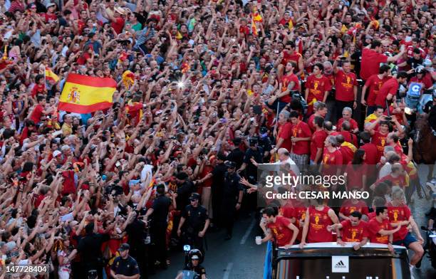 The Spanish national football team parades on July 2, 2012 in Madrid, a day after it won the final match of the Euro 2012 championships 4-0 against...