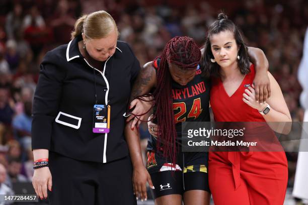 Bri McDaniel of the Maryland Terrapins is helped off the court after suffering an injury during the second quarter of the game against the South...