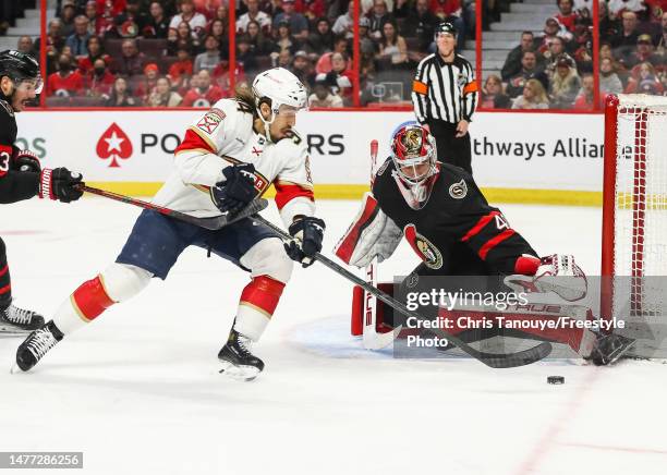 Mads Sogaard of the Ottawa Senators makes a pad save against Ryan Lomberg of the Florida Panthers during the first period at Canadian Tire Centre on...