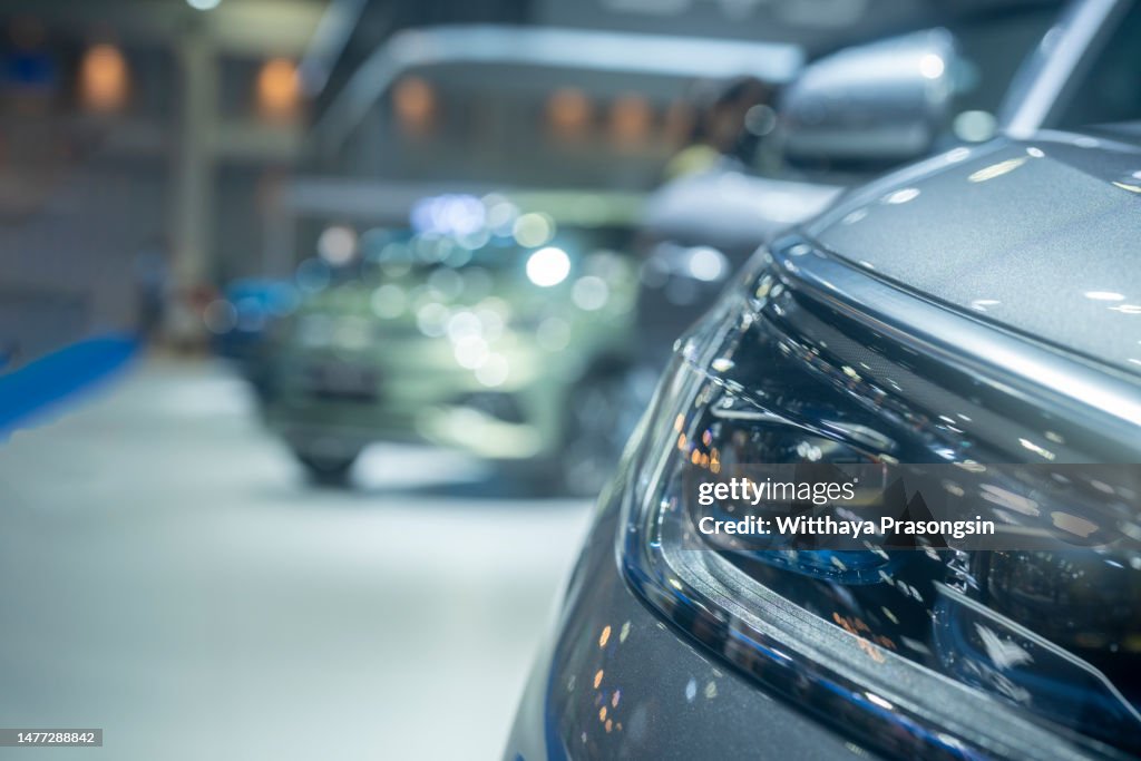 Line of new compact cars at dealership
