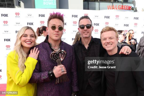 Tanya Rad; Jacoby Shaddix and Jerry Horton of Papa Roach; and JoJo Wright attend the 2023 iHeartRadio Music Awards at Dolby Theatre in Los Angeles,...