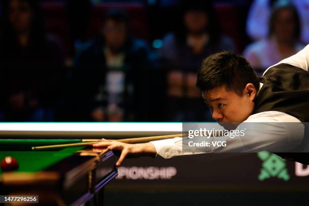 Ding Junhui of China plays a shot in the quarter-final match against Mark Allen of Northern Ireland on day 1 of Tour Championship Snooker 2023 at the...