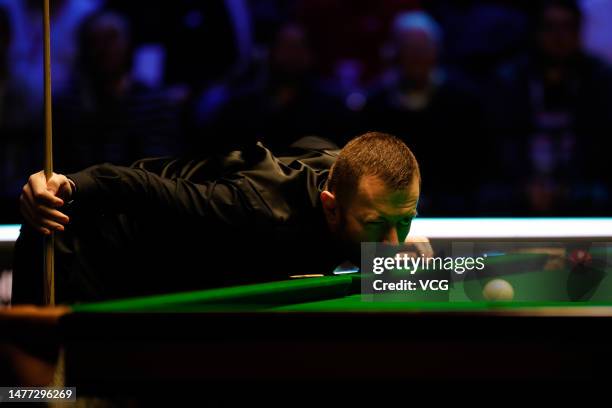 Mark Allen of Northern Ireland plays a shot in the quarter-final match against Ding Junhui of China on day 1 of Tour Championship Snooker 2023 at the...