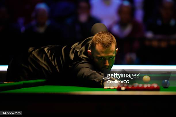 Mark Allen of Northern Ireland plays a shot in the quarter-final match against Ding Junhui of China on day 1 of Tour Championship Snooker 2023 at the...